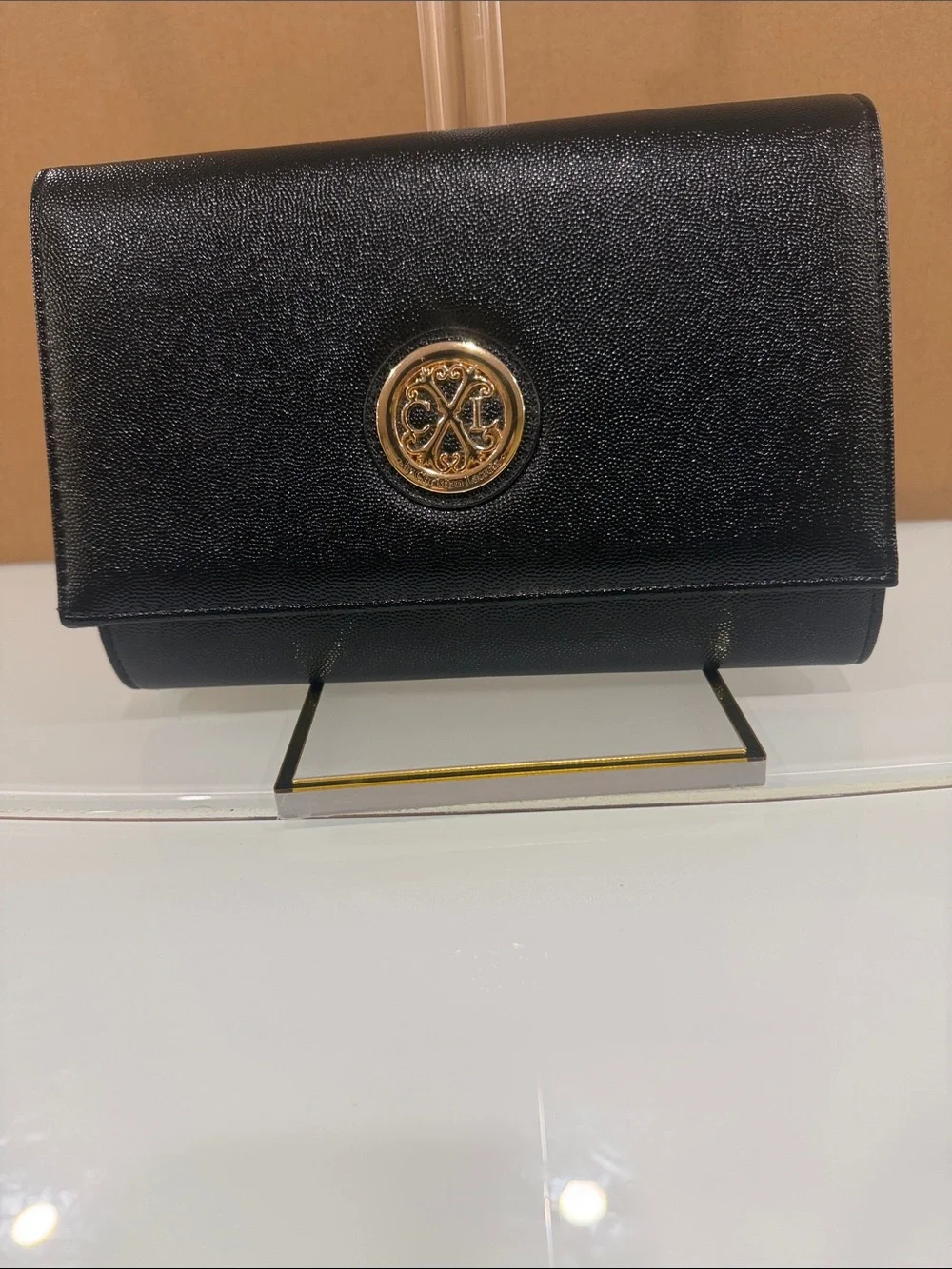 Black Leather Crossbody Bag with Gold Logo Accent